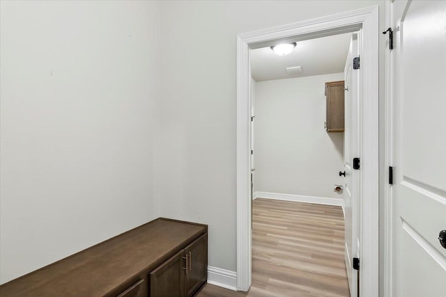 mudroom with light hardwood / wood-style floors