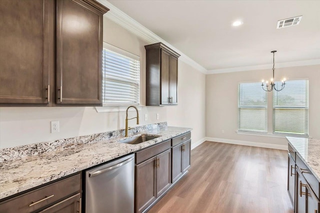 kitchen featuring crown molding, sink, stainless steel dishwasher, and a notable chandelier