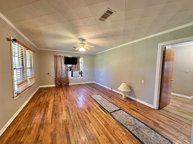 unfurnished room with wood-type flooring, ceiling fan, and ornamental molding