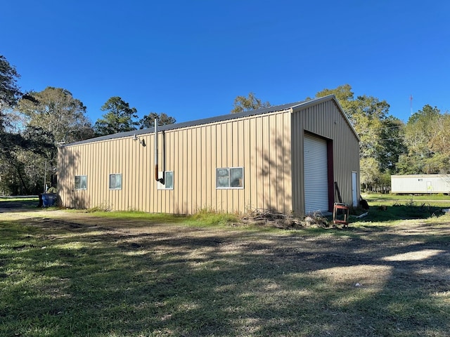 exterior space featuring a yard and a garage