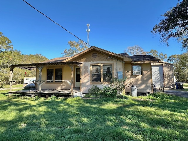 back of property featuring a porch and a lawn