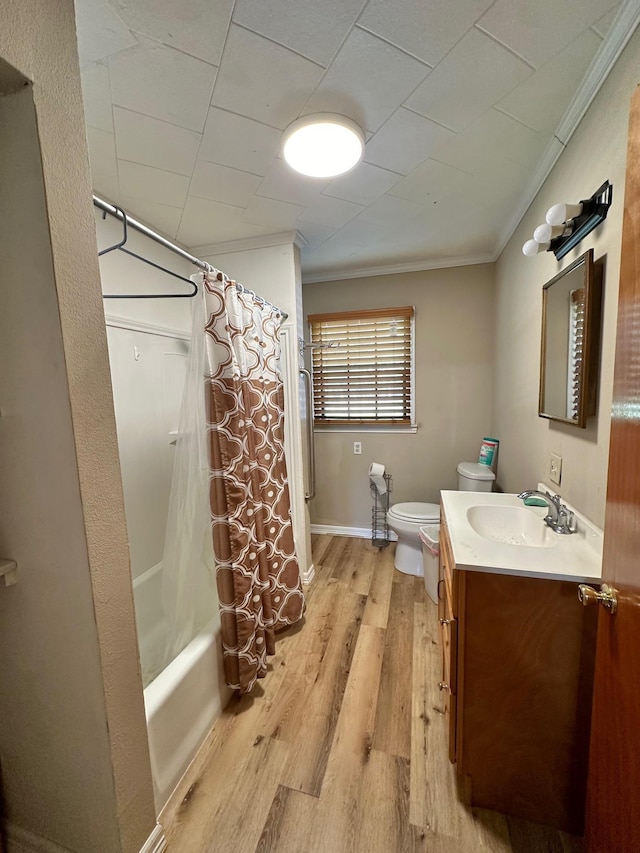 full bathroom with crown molding, shower / bath combination with curtain, wood-type flooring, toilet, and vanity