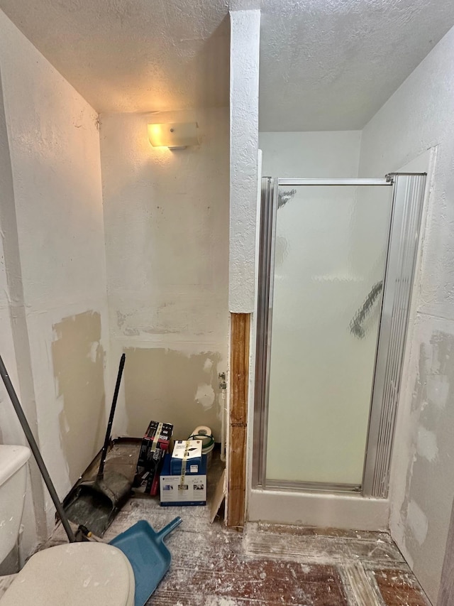 bathroom with a shower with shower door