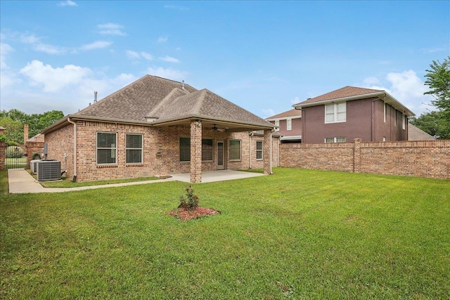 rear view of house featuring a patio, a yard, ceiling fan, and fence