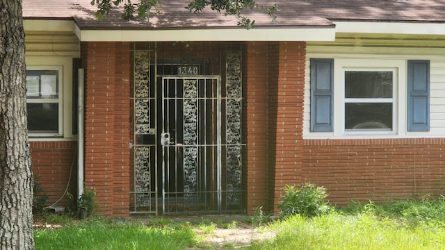 1340 E Dr, Beaumont, TX 77706 - doorway to property featuring brick siding