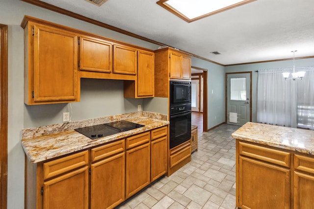 kitchen featuring decorative light fixtures, brown cabinets, visible vents, black appliances, and ornamental molding