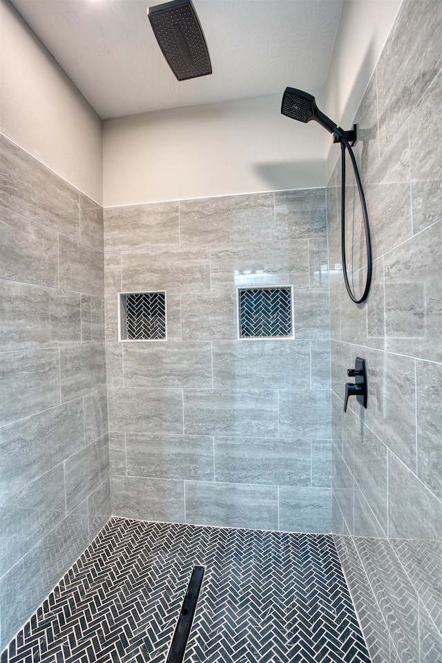 full bathroom with a tile shower