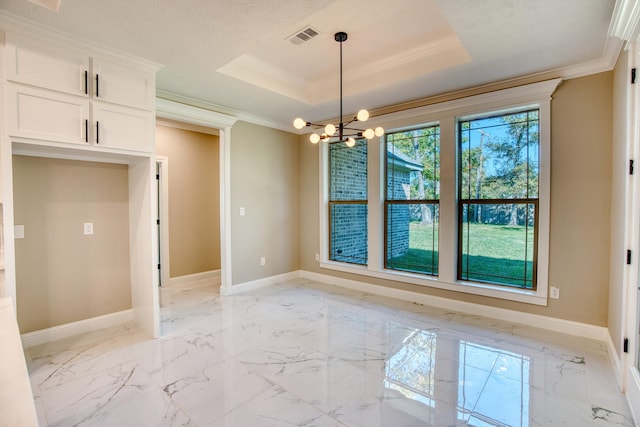 unfurnished dining area featuring baseboards, a tray ceiling, and crown molding