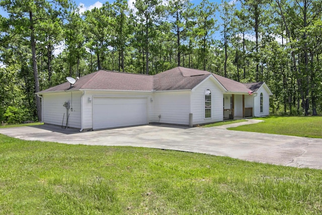 view of front of home with a garage and a front lawn