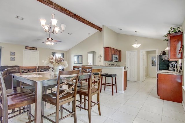 tiled dining room with sink, high vaulted ceiling, beamed ceiling, and ceiling fan