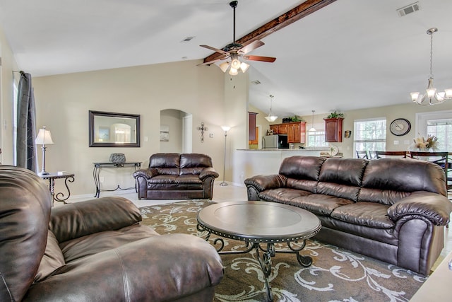 living room with high vaulted ceiling, beamed ceiling, and ceiling fan with notable chandelier