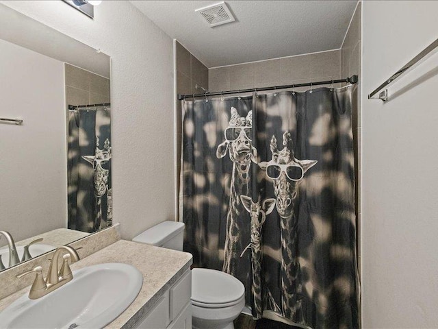 bathroom featuring vanity, toilet, curtained shower, and visible vents