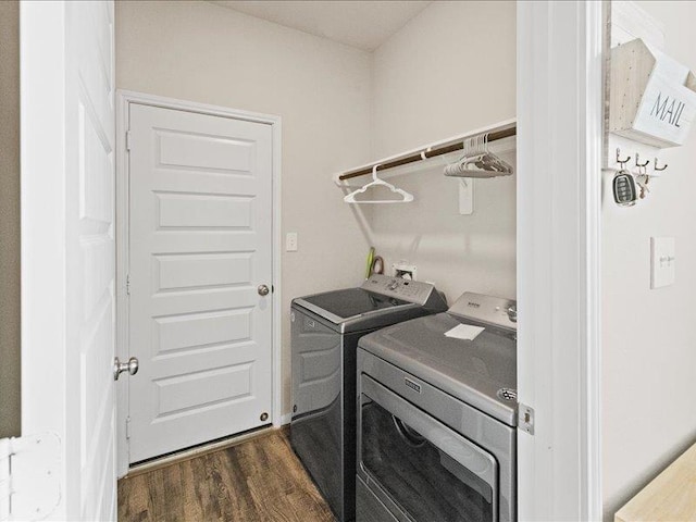 laundry room with independent washer and dryer, laundry area, and dark wood finished floors