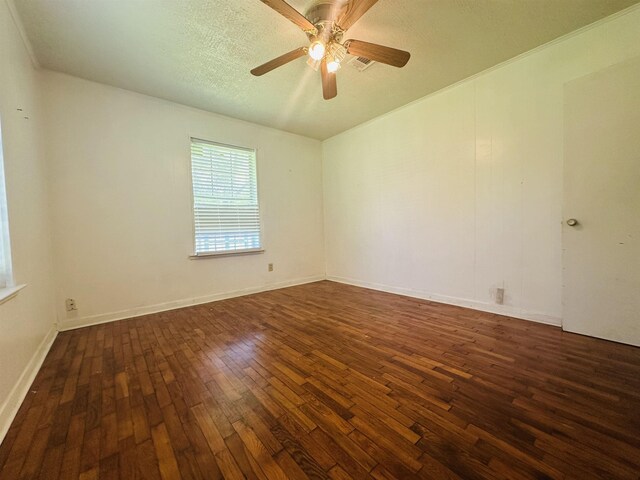 2922 Little Cypress Dr, Orange, TX 77632 - spare room featuring dark wood-style floors, ceiling fan, and a textured ceiling