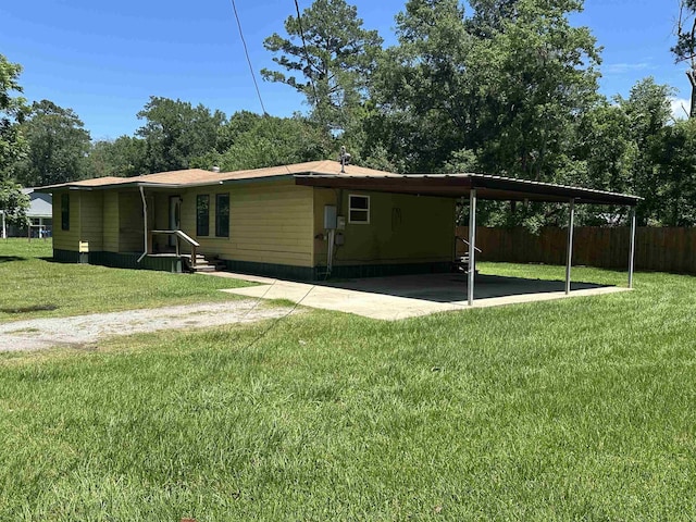 2922 Little Cypress Dr, Orange, TX 77632 - view of side of property featuring a carport