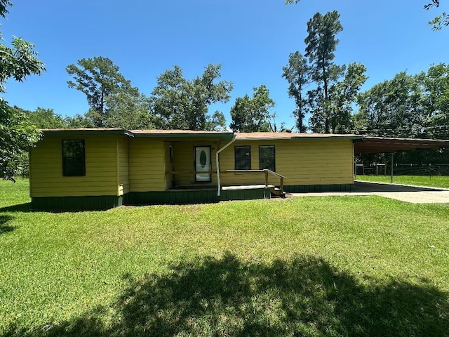 2922 Little Cypress Dr, Orange, TX 77632 - manufactured / mobile home featuring an attached carport, a front yard, and concrete driveway