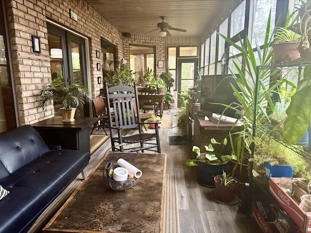 sunroom featuring ceiling fan