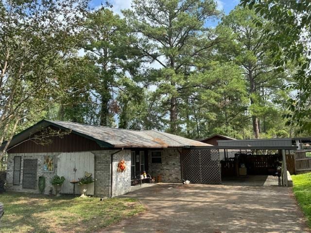 view of front of home with a carport