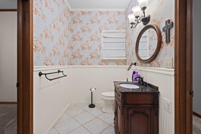 10425 Bussey Rd, Silsbee, TX 77656 - half bath with wainscoting, vanity, crown molding, and tile patterned flooring