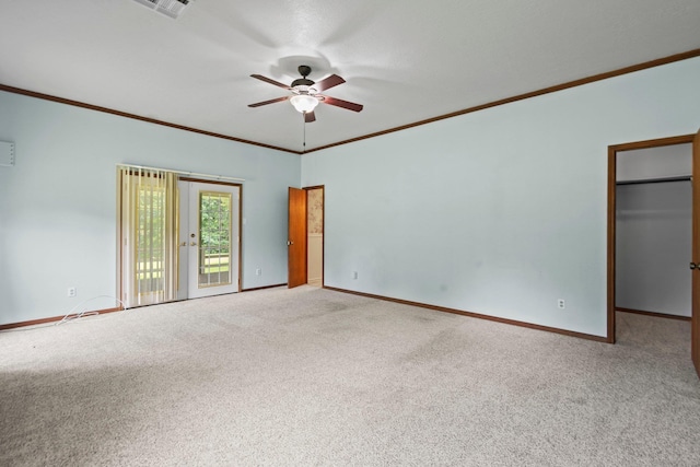 10425 Bussey Rd, Silsbee, TX 77656 - empty room featuring carpet, a ceiling fan, and crown molding