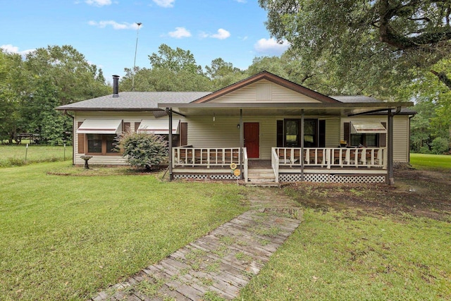10425 Bussey Rd, Silsbee, TX 77656 - view of front of property featuring covered porch and a front lawn