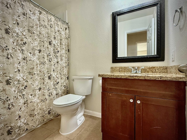 bathroom with tile patterned flooring, vanity, curtained shower, and toilet