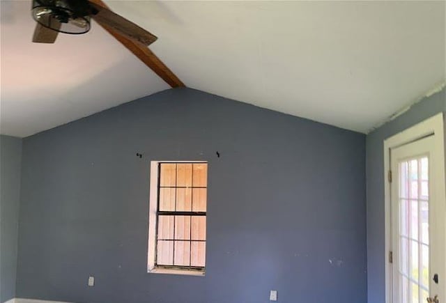 unfurnished room featuring ceiling fan and lofted ceiling