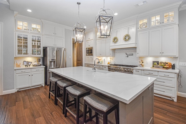 131 Oakdale, Silsbee, TX 77656 - kitchen with visible vents, dark wood-style floors, high quality appliances, white cabinets, and a sink