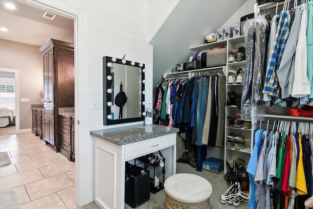 spacious closet featuring light tile patterned flooring