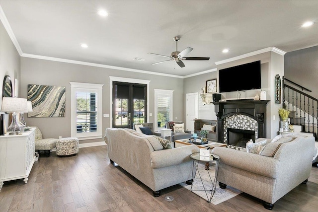 living room with ceiling fan, hardwood / wood-style floors, french doors, and ornamental molding