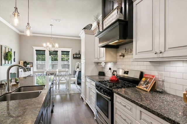 kitchen featuring white cabinets, dark stone countertops, sink, and stainless steel appliances