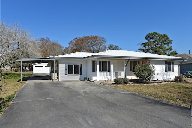 single story home with a porch, a garage, a carport, and a front lawn