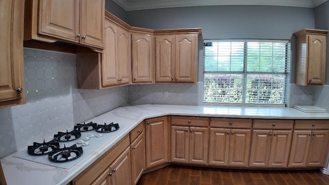 kitchen featuring tasteful backsplash, white gas stovetop, crown molding, and dark wood-type flooring