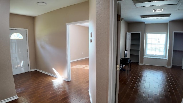 foyer featuring dark wood-type flooring