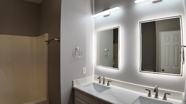 bathroom featuring vanity and walk in shower