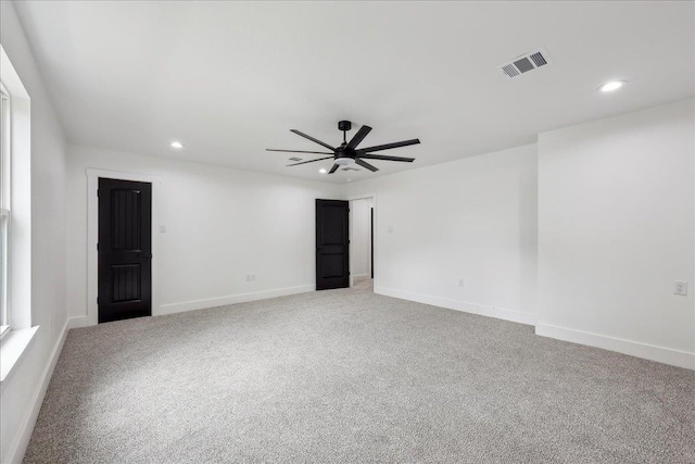 unfurnished room with baseboards, recessed lighting, visible vents, and light carpet