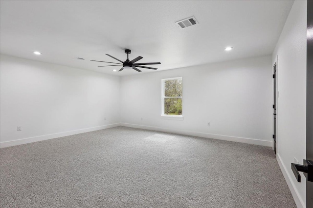 carpeted empty room featuring baseboards, recessed lighting, visible vents, and ceiling fan