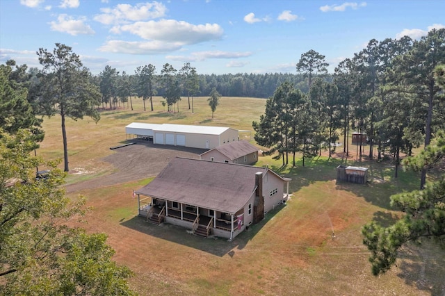 birds eye view of property with a rural view