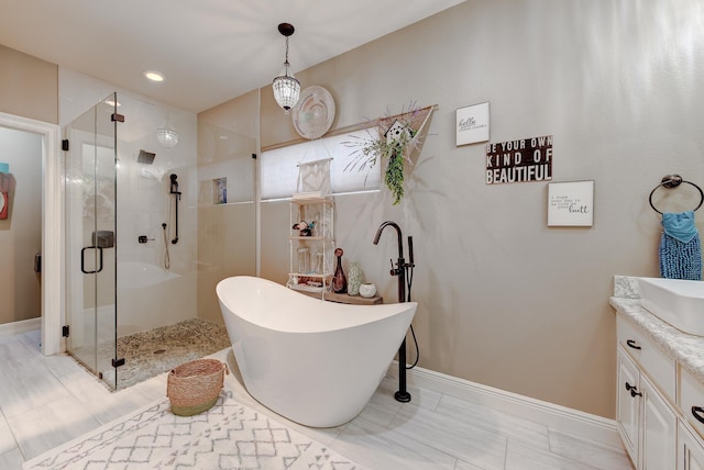 bathroom featuring vanity and plus walk in shower