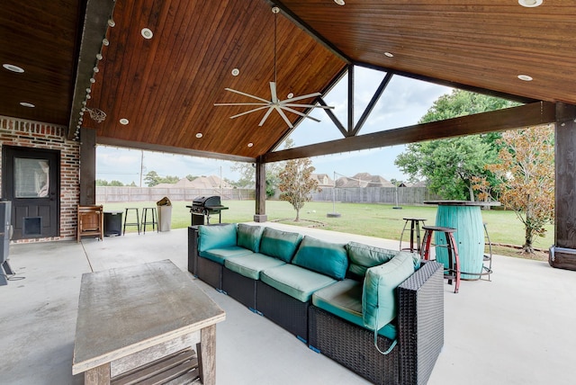 view of patio featuring a gazebo, grilling area, outdoor lounge area, and exterior bar