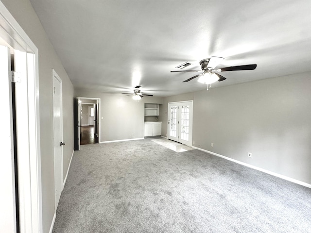 3025 19th St, Beaumont, TX 77706 - unfurnished room with a ceiling fan, french doors, baseboards, and carpet floors