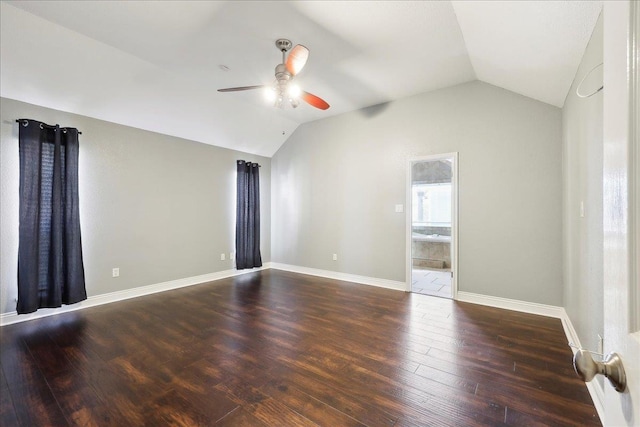 spare room with lofted ceiling, dark hardwood / wood-style flooring, and ceiling fan