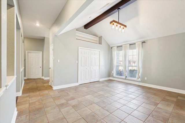 interior space featuring lofted ceiling with beams