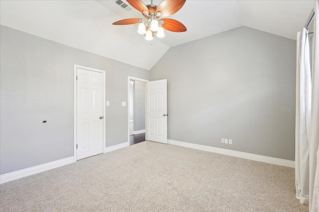 unfurnished bedroom with vaulted ceiling, ceiling fan, and carpet flooring