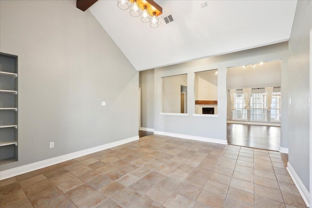 unfurnished living room featuring beamed ceiling, a large fireplace, and high vaulted ceiling