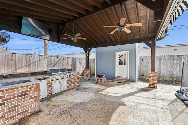 view of patio / terrace featuring area for grilling, sink, grilling area, and ceiling fan