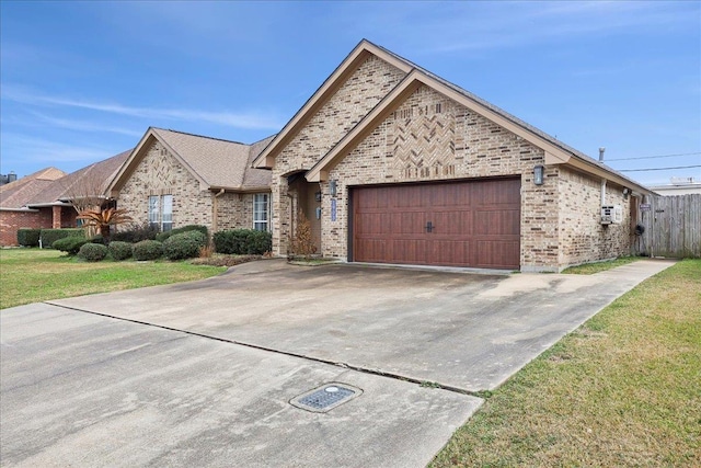 view of front facade with a garage and a front lawn