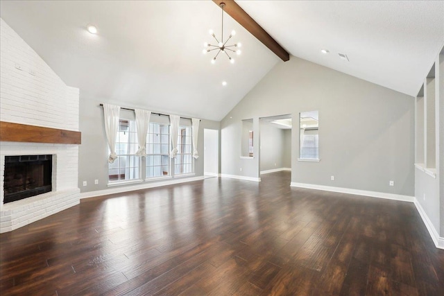 unfurnished living room with an inviting chandelier, high vaulted ceiling, dark hardwood / wood-style flooring, beamed ceiling, and a fireplace