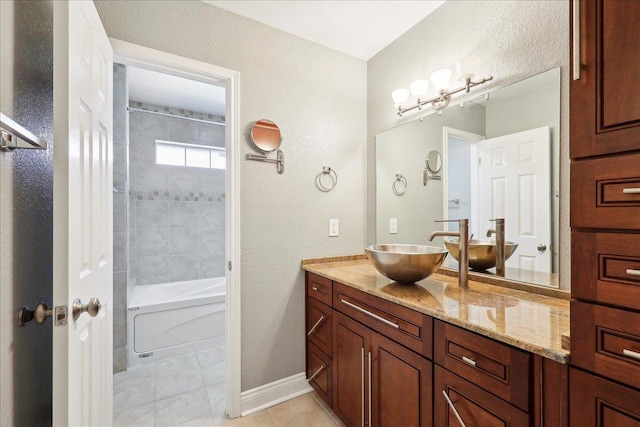 bathroom with vanity, tiled shower / bath combo, and tile patterned floors