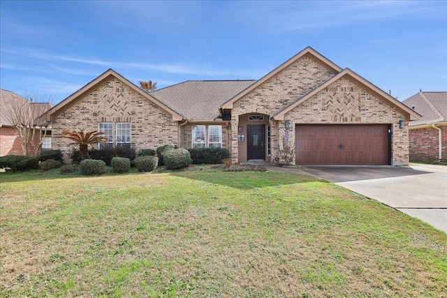 view of front of house with a garage and a front yard